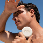 Man holding OLYN perfumed soap for men